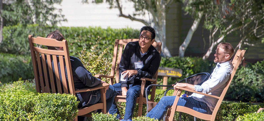 3 men in rocking chairs